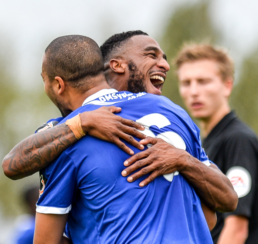 The referee watches the celebrations