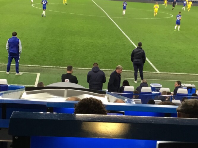 Wally Downes enters the AFC Wimbledon dugout in the second half and arranges an instant double substitution