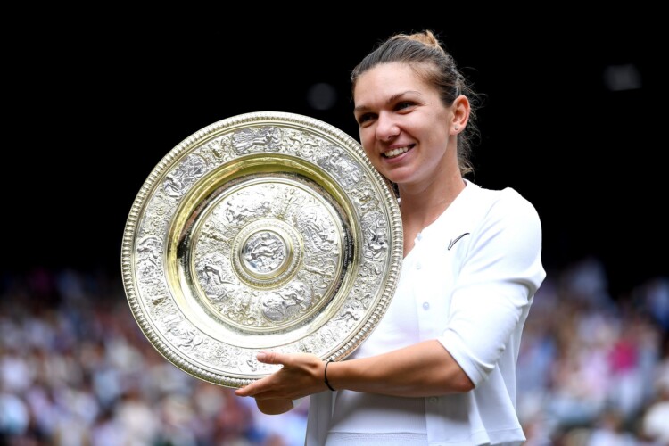 Simona Halep celebrates with the trophy after winning the women's singles final