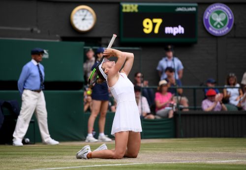 Simona Halep drops to her knees after winning Wimbledon