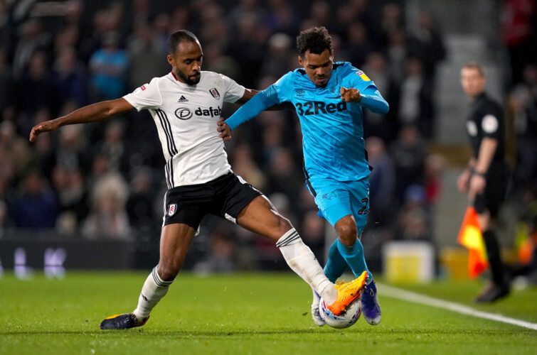 Fulham's Denis Odoi (left) and Derby County's Duane Holmes battle for the ball