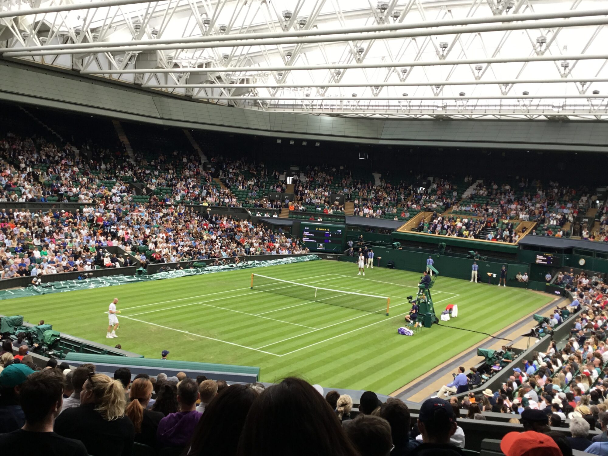 Roger Federer and Adrian Mannarino on Centre Court Picture by Paul Lagan