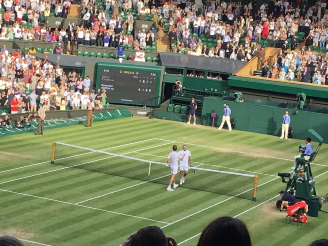 Dan Evans and Sebastian Korda on Centre Court Photo: Paul Lagan