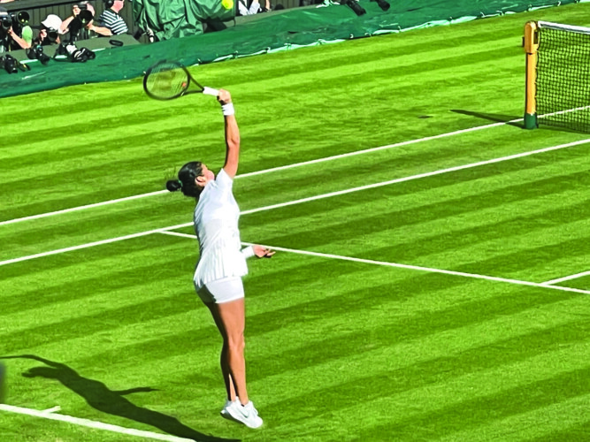 Emma Raducanu serving on Centre Court Pictures: Paul Lagan
