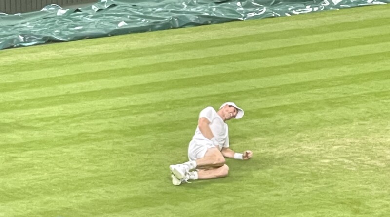 Murray hits the grass but gets up to win the game and the third set Picture: Paul Lagan