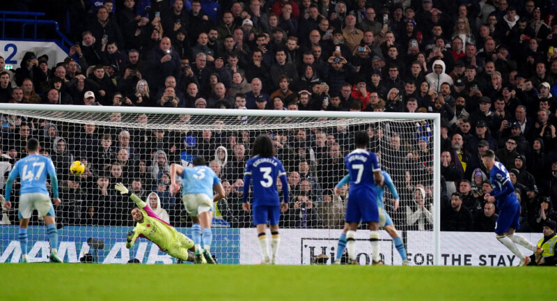 Chelsea's Cole Palmer (right) scores their side's fourth goal of the game during the Premier League match at Stamford Bridge, London. Picture date: Sunday November 12, 2023.