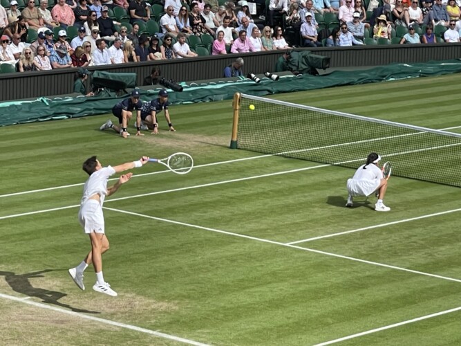Joe Salisbury serve with Heather Watson at the net Picture by Paul Lagan
