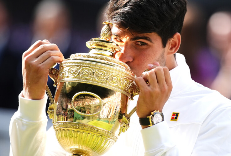 Carlos Alcaraz celebrates with the trophy after victory in the Gentlemen's Singles Final against Novak Djokovic (not pictured) on day fourteen of the 2024 Wimbledon Championships at the All England Lawn Tennis and Croquet Club, London. Picture date: Sunday July 14, 2024 Picture: PA